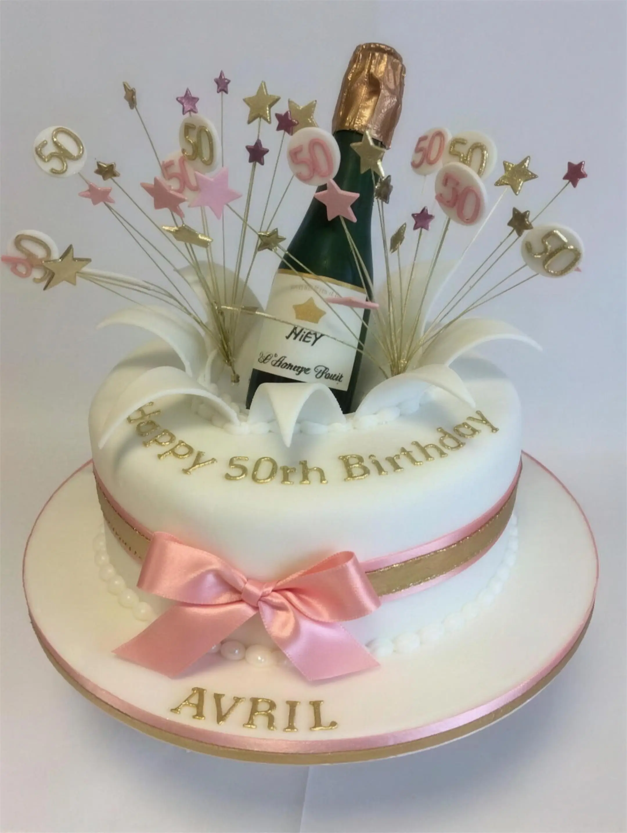 Round champagne celebration cake with gold detailing by Catherine Scott