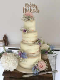 Semi-Naked Four-Tier Wedding Cake by Catherine Scott