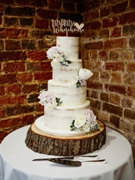 Semi-Naked Four-Tier Wedding Cake by Catherine Scott