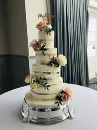 Semi-Naked Four-Tier Wedding Cake by Catherine Scott