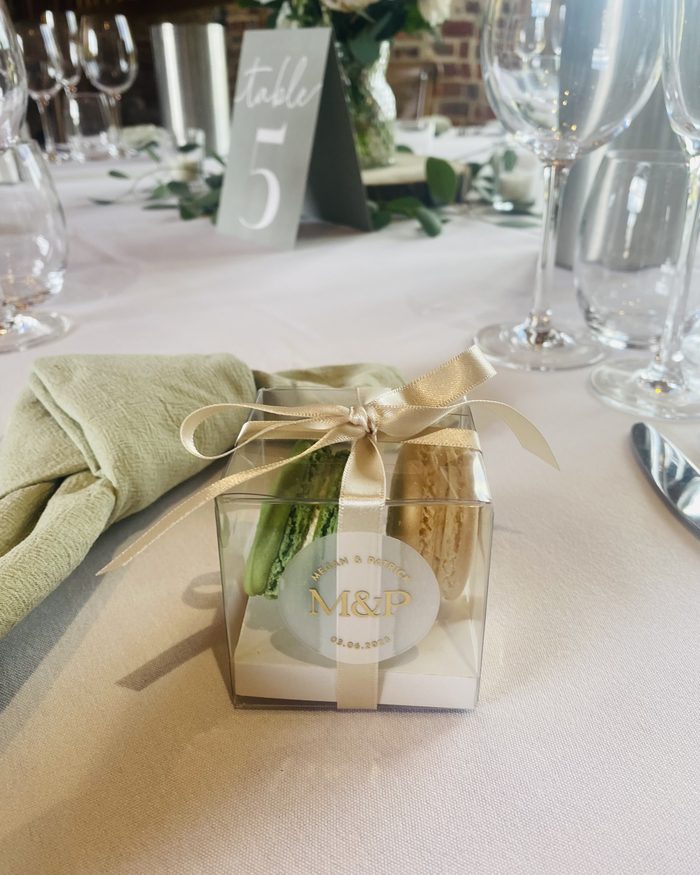 Personalised macaron wedding favour box with a gold monogram by Catherine Scott